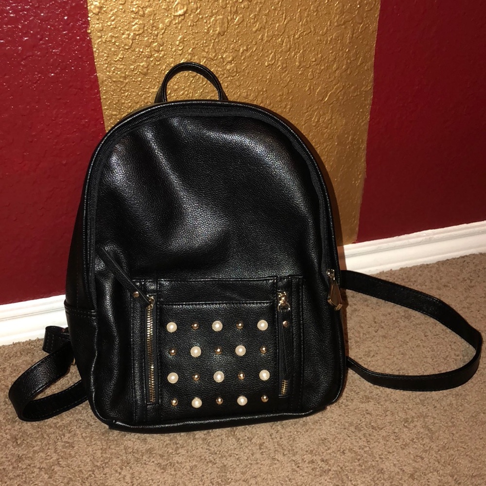 Studded black leather mini backpack